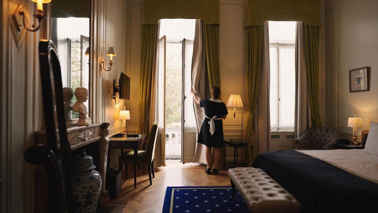 Stanhope Hotel By Thon Hotels Брюссель Экстерьер фото A chambermaid opening the curtains in a hotel room